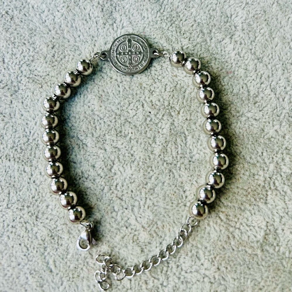 Bundle includes Saint Benedict bracelet key chains